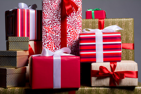 Gifts on a red background for a holiday, Christmas, anniversary.の写真素材