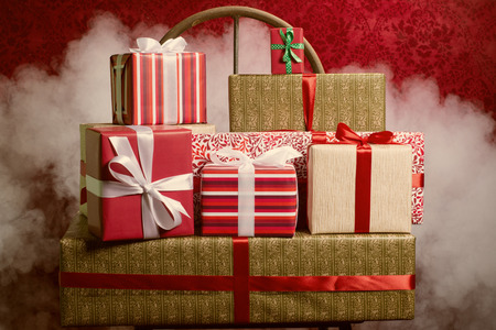 Gifts for Holidays, Christmas, anniversary on a beautiful background with smoke and stars. Vintage colorの写真素材