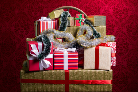 Gifts for Holidays, Christmas, anniversary on beautiful red backgroundの写真素材