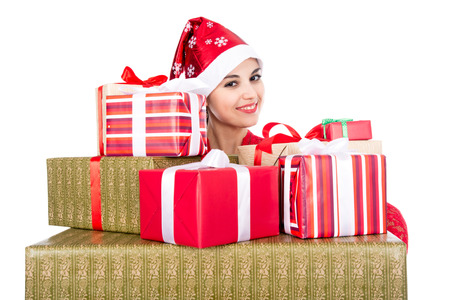 Beautiful christmas woman is holding gift in studio. Isolated on a white backgroundの写真素材