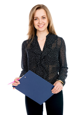 Beautiful cheerful business woman with tablet and pen for notes. Young business entrepreneur. Isolated on white backgroundの写真素材