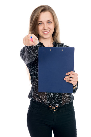 Resolute woman businessman in dark blouse pen points at the camera. Isolated on a white background. Successful business womanの写真素材
