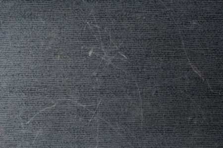 Old and scratched abstract dark background.の写真素材