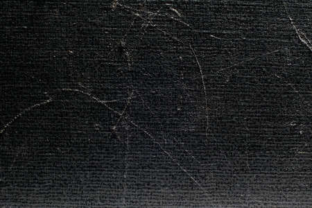 Old and scratched abstract dark background.の写真素材