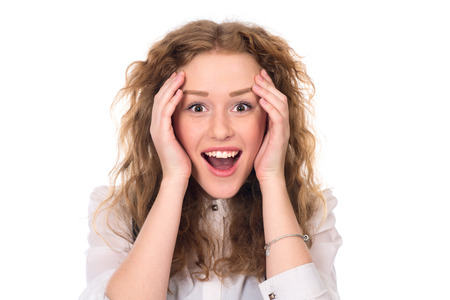 Happy surprised young female student. Isolated on a white の写真素材