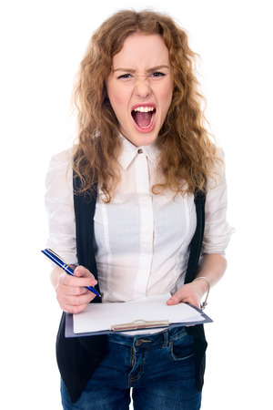 Angry mad businesswoman crazy boss furious woman screaming isolated on white. Stress in business work. Negative emotions.の写真素材
