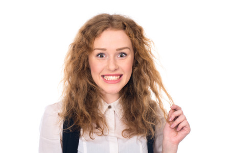 Happy surprised young female student. Isolated on a white の写真素材
