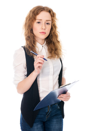 Business woman with pen and tablet for notes. Isolated on a white の写真素材