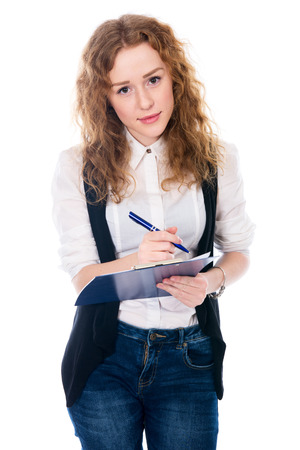 Cheerful business woman with pen and tablet for notes. Isolated on a white の写真素材