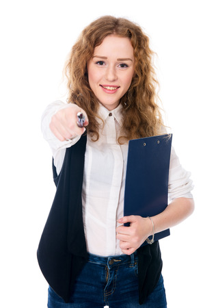 Resolute woman businessman pen points at the camera. Isolated on a white . Successful business womanの写真素材