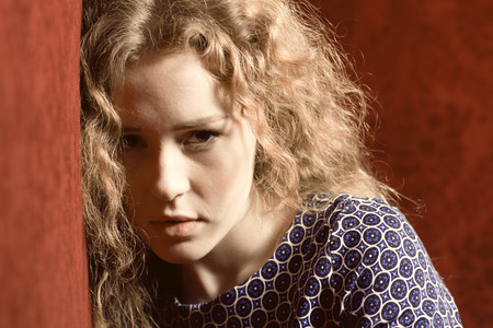 Closeup portrait of sad, depressed, stressed, thoughtful young woman, full of worries, looking at you. Human face expressions, emotions, feelings, reaction, attitudeの写真素材