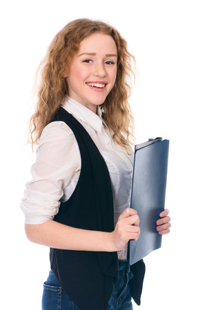 Portrait of happy young business woman. Cheerful secretary with folders. Isolated on white background.の写真素材