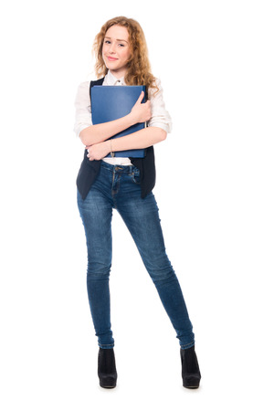 Portrait of happy young business woman. Cheerful secretary in full growth with folders. Isolated on white background.の写真素材