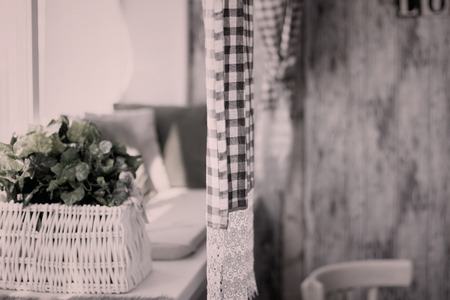 Interior rustic rooms with curtains and flowers on the windowsill. In a retro style toned imageの写真素材