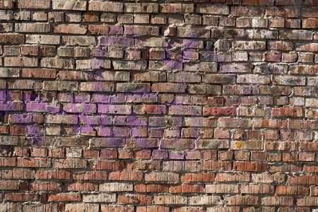 Old brick wall background with elements of paint. Vintage wall in daylight brickの写真素材