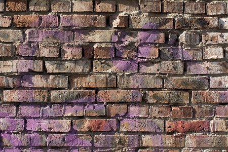 Old brick wall background with elements of paint. Vintage wall in daylight brickの写真素材