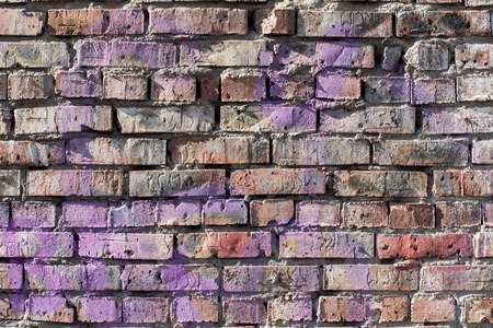 Old brick wall background with elements of paint. Vintage wall in daylight brickの写真素材