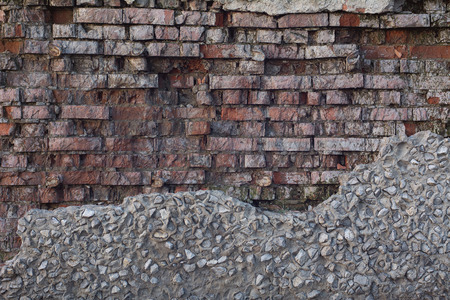 Background old ruined brick wall. Vintage red brick wall.の写真素材