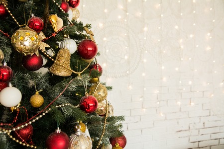 Pretty dressed up Christmas tree closeup. Background for the holiday with space for textの写真素材