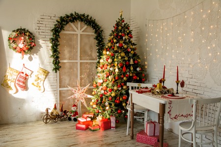 Interior room with Christmas fir and the banquet table in the style of a country houseの写真素材