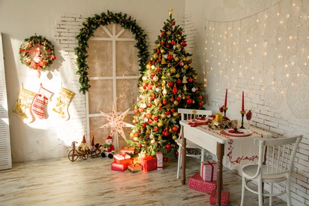 Interior room with Christmas fir and the banquet table in the style of a country houseの写真素材