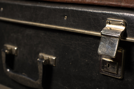 Close-up of a suitcase. Iron Castle vintage bag. Place of storage