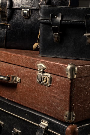 Close-up of a stack of vintage shabby suitcases. Concept traveler distant countries.の写真素材