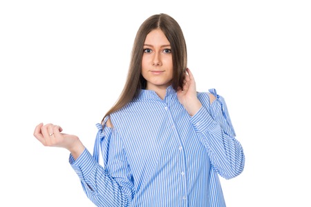 Portrait of a beautiful young woman in a striped shirt. Isolated on white backgroundの写真素材