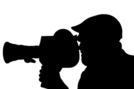 Silhouette of a bearded man in the side of the camcorder. cinema operator cap documentary TVの写真素材