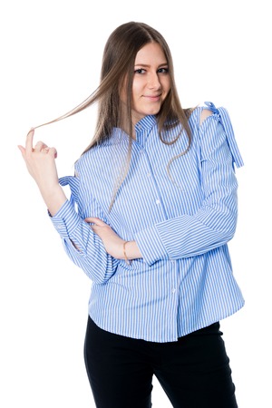 Smiling business woman against white background. Girl striped shirtの写真素材