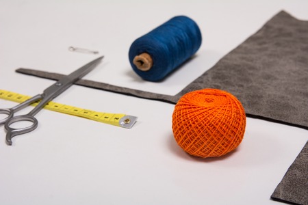 Background for tailor fabric yarn and sewing tools. Scissors and measuring tapeの写真素材