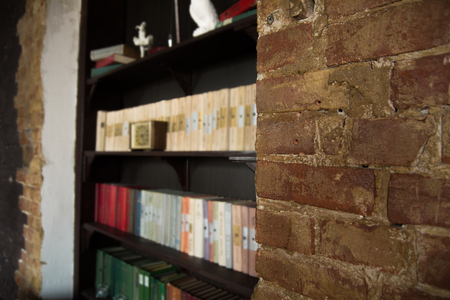 Background brick brown wall and bookshelf in a nicheの写真素材