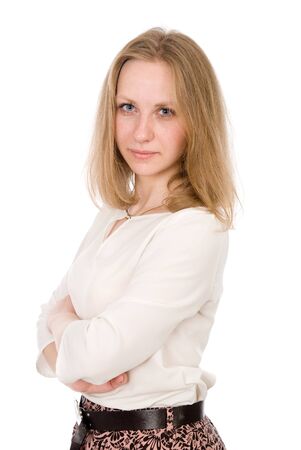 Portrait of a young woman with arms crossed isolated over a white backgroundの写真素材