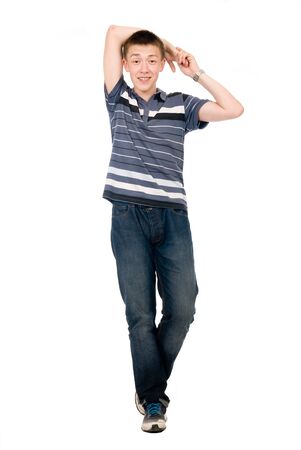 Cheerful young man in full growth isolated over white background.の写真素材