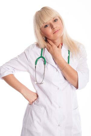 Portrait of a doctor in a white coat with a stethoscope isolated over a light background.の写真素材