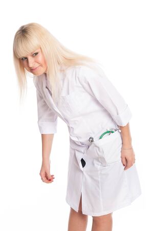 Young woman nurse in a white coat. Doctor isolated on a white backgroundの写真素材