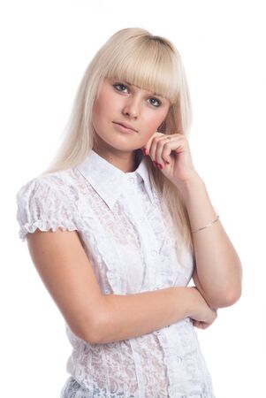 Blond young woman thinking an idea while looking up isolated over a white background.の写真素材