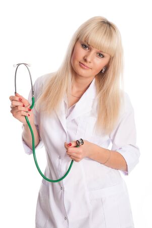 Portrait of a doctor in a white coat with a stethoscope isolated over a light background.の写真素材