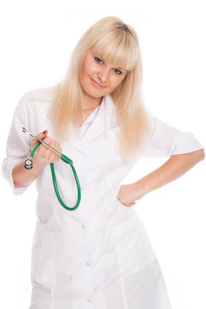 Portrait of a doctor in a white coat with a stethoscope isolated over a light background.の写真素材