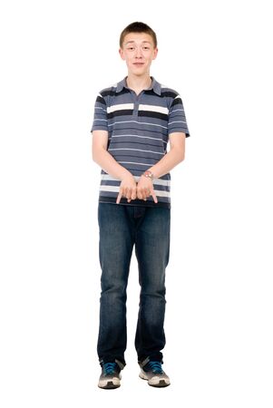 Portrait of young man doing a rock and roll symbol over white backgroundの写真素材