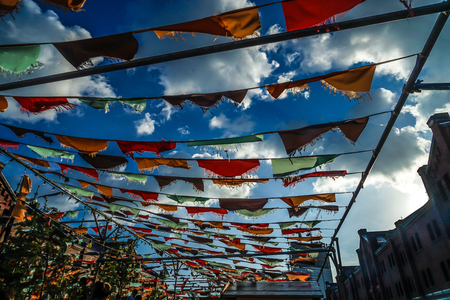 Colorful cloth and summer sky flutteringの写真素材