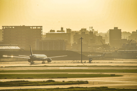 Airplane and city silhouette (Haneda Airport)のeditorial素材