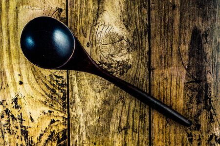 Spoon placed on a wooden tableの写真素材