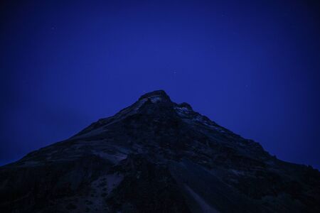 Mountain silhouette and starry sky (Iceland)の写真素材
