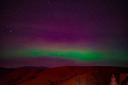 Of Iceland Aurora and mountain silhouetteの写真素材