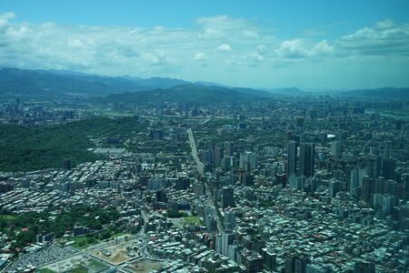 Taipei cityscape and blue sky visible from Taipei 101の写真素材