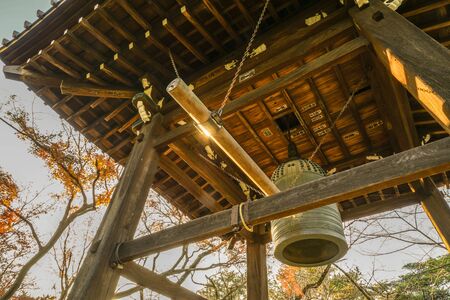 Temple bell and autumn colors of the imageの写真素材