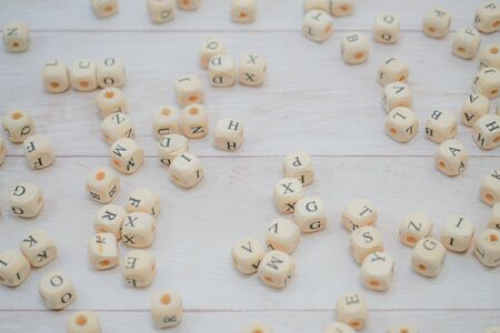 Block of alphabet studded on the floor