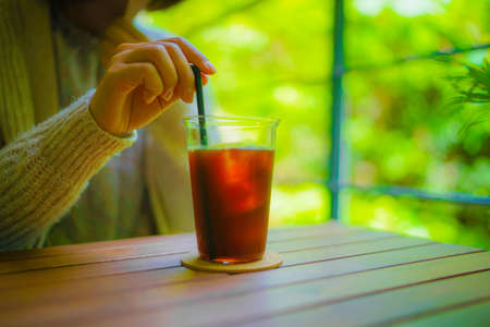 Image of women drinking ice coffeeの写真素材