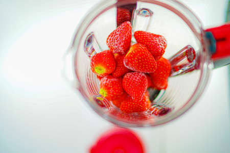 Frozen strawberry placed in a mixerの写真素材